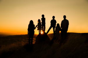 Family at Sunset; mother, father and 4 children