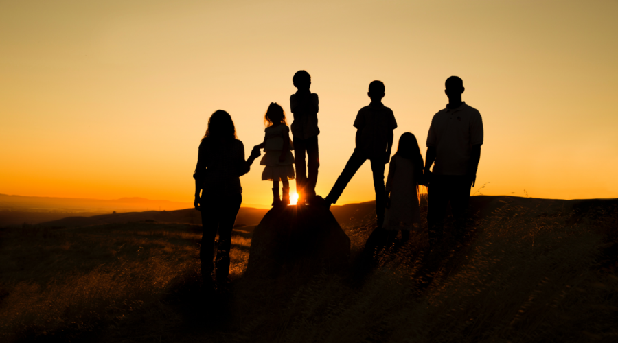 Family at Sunset; mother, father and 4 children